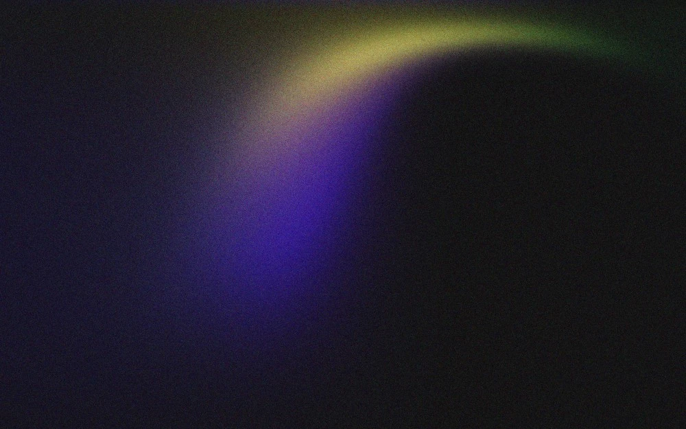 A dark rectangle with a blue, purple and yellow streak pattern