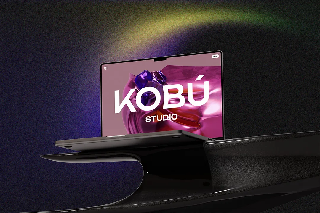 A MacBook on a steel metal table top showcasing Kobu Studio Website